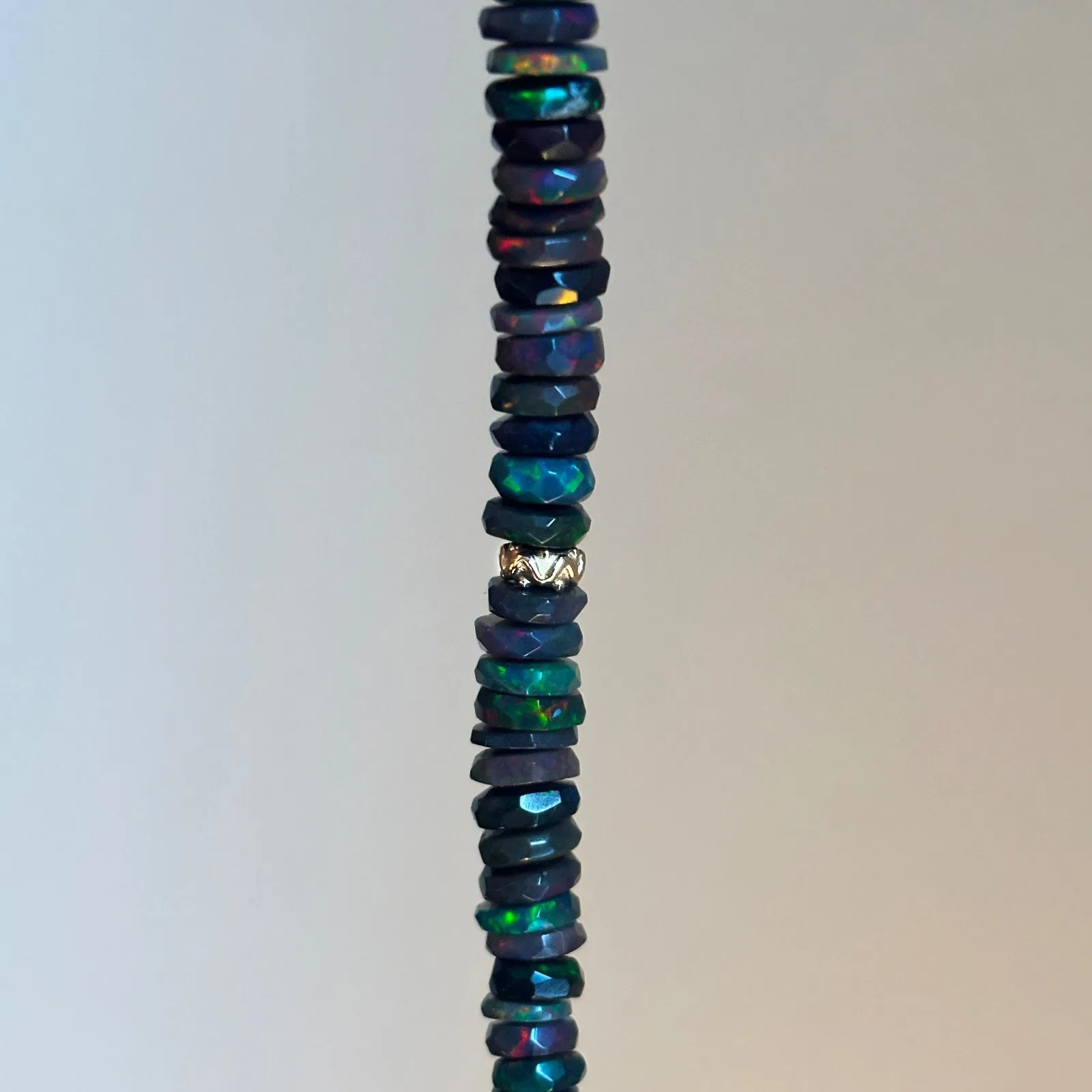 Faceted Black Opal Heishi with Gold Beads