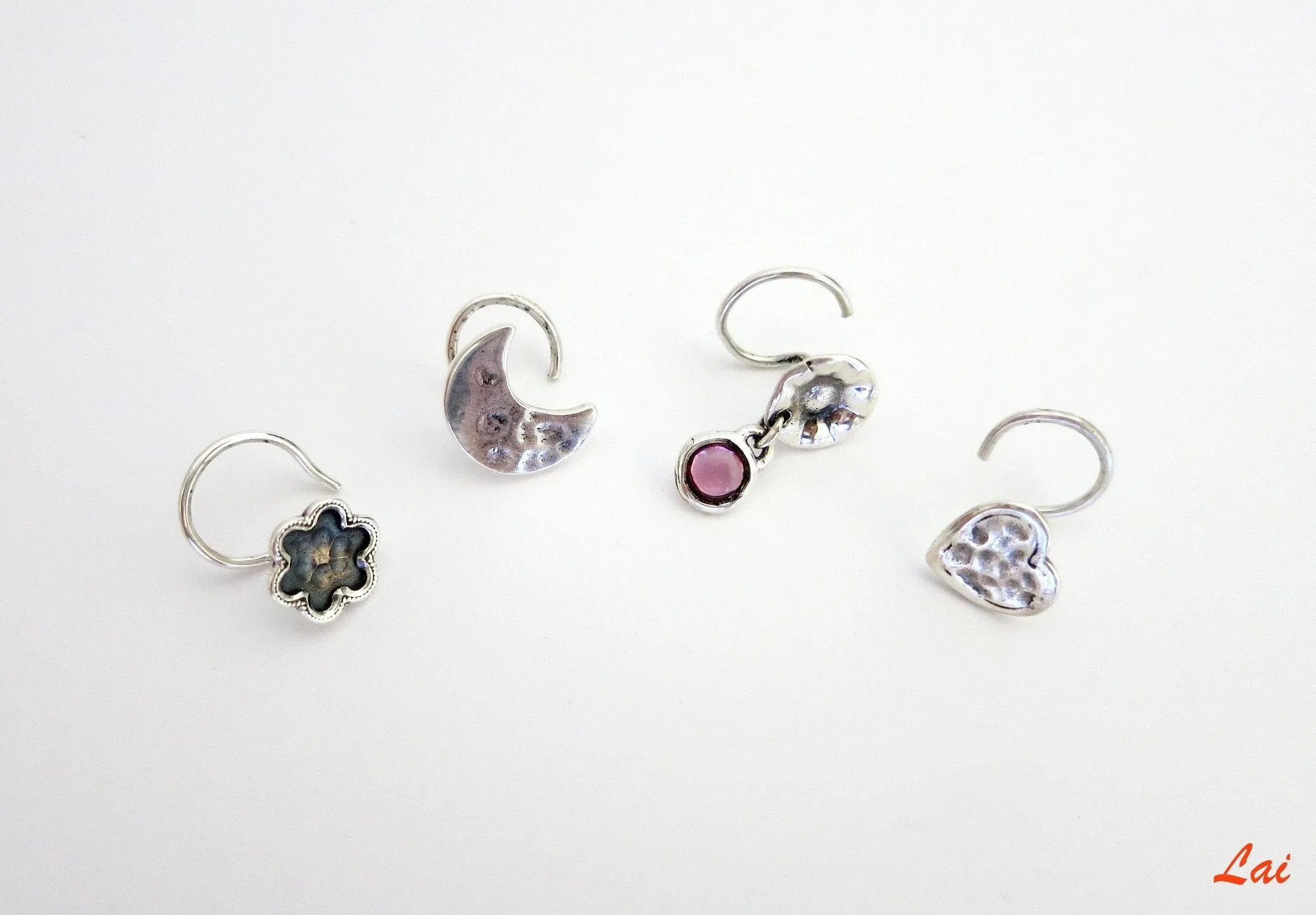 Fun, and quaint hammer-finish heart nose pin