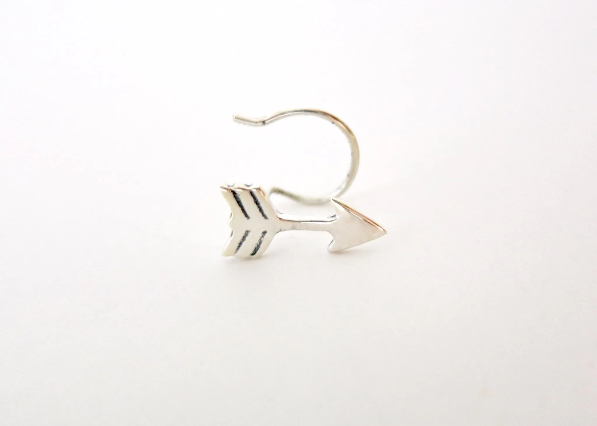 Quirky, fun, arrow nose pin